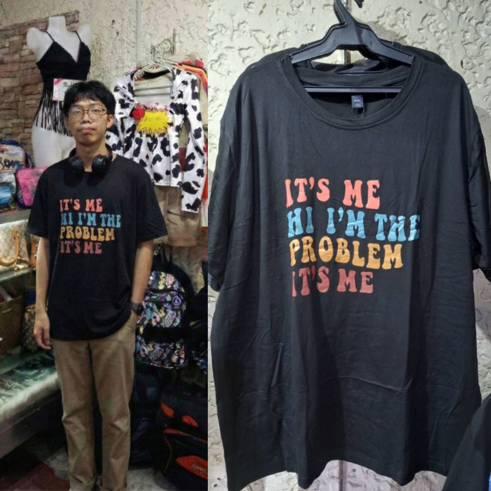 It's Me Hi Anti-Hero Black XXL Graphic Tee displayed on a hanger next to a person wearing it in a shop.